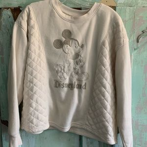 Matching sweatshirt and sweatpants set with Mickey Mouse on it